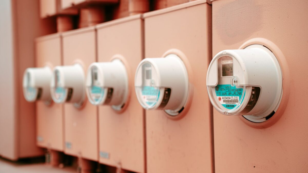 Close-up view of a row of industrial electricity meters for power monitoring and technology.